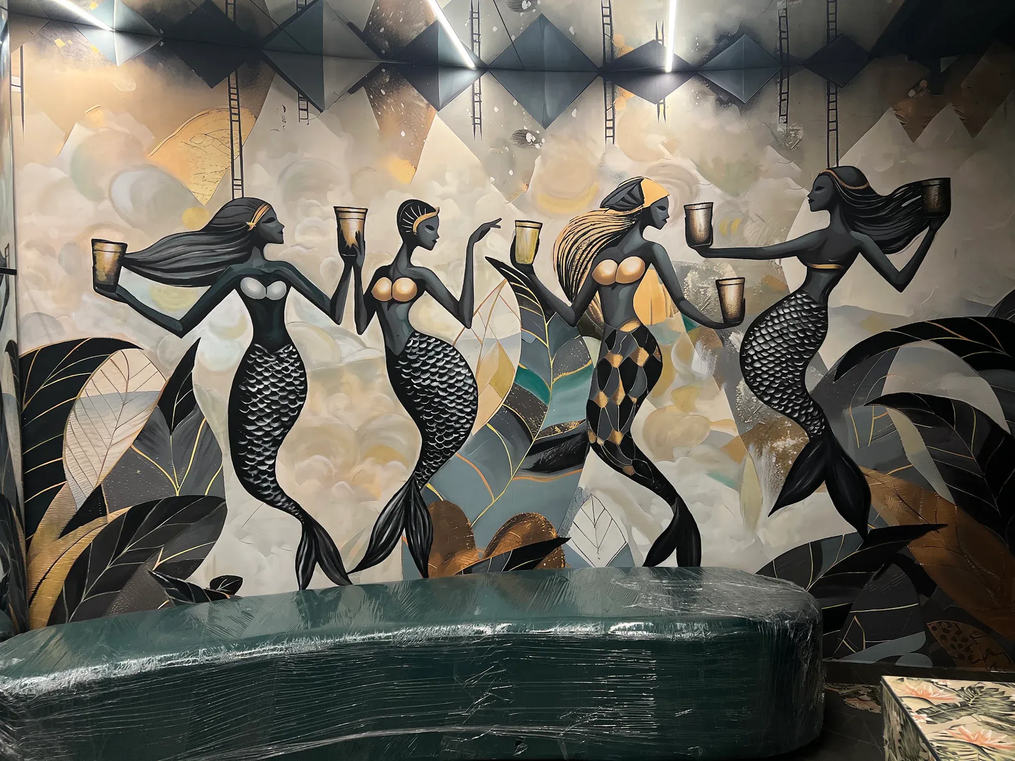 Detailed view of dancing figures in the CIEL lounge mural