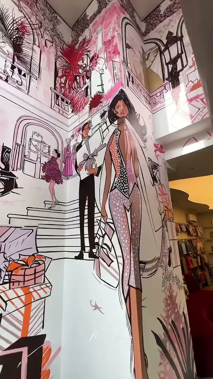 Fashion illustration mural installed in the SabbleLuxury retail space